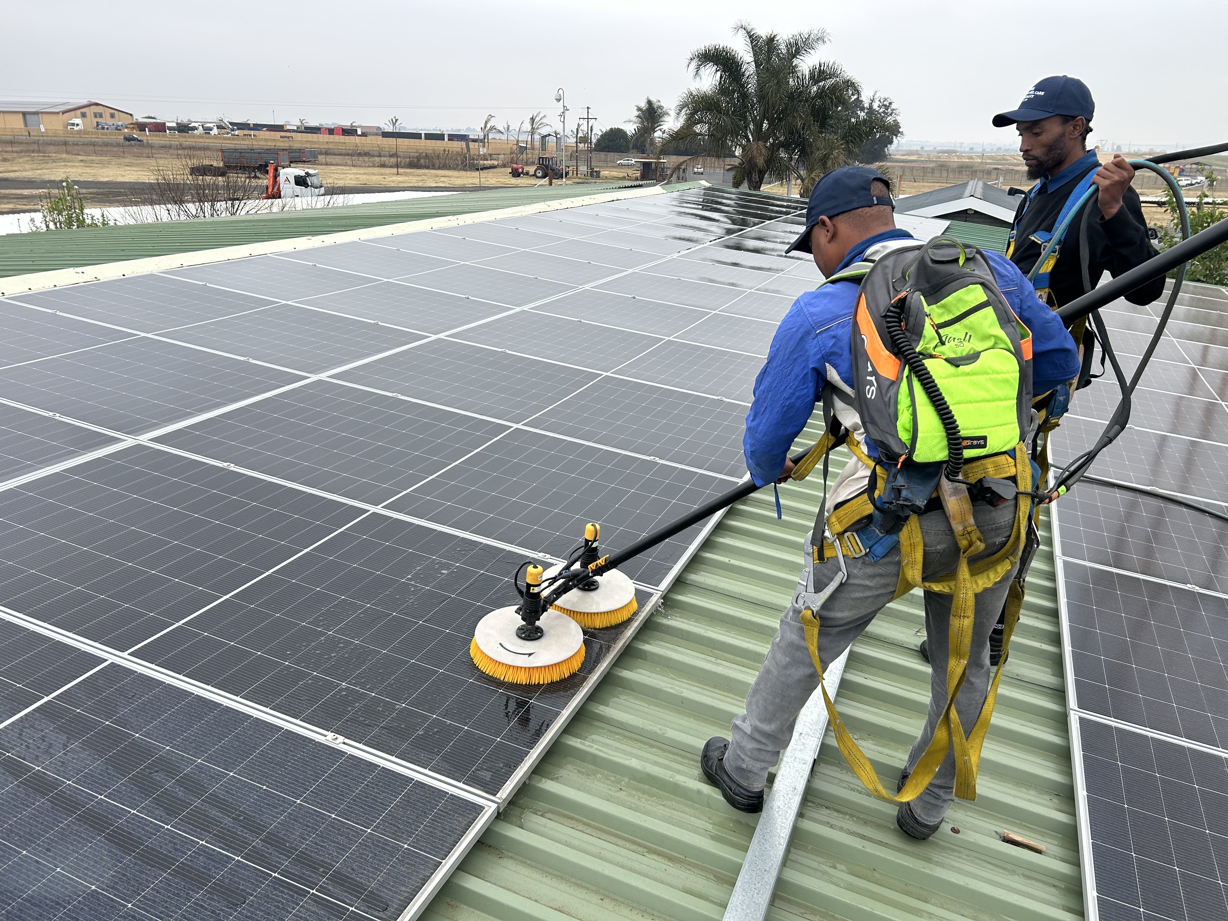 Purpose-built equipment cleaning a solar panel array